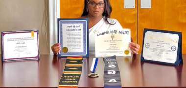 student displaying their certificates and achievements before graduation